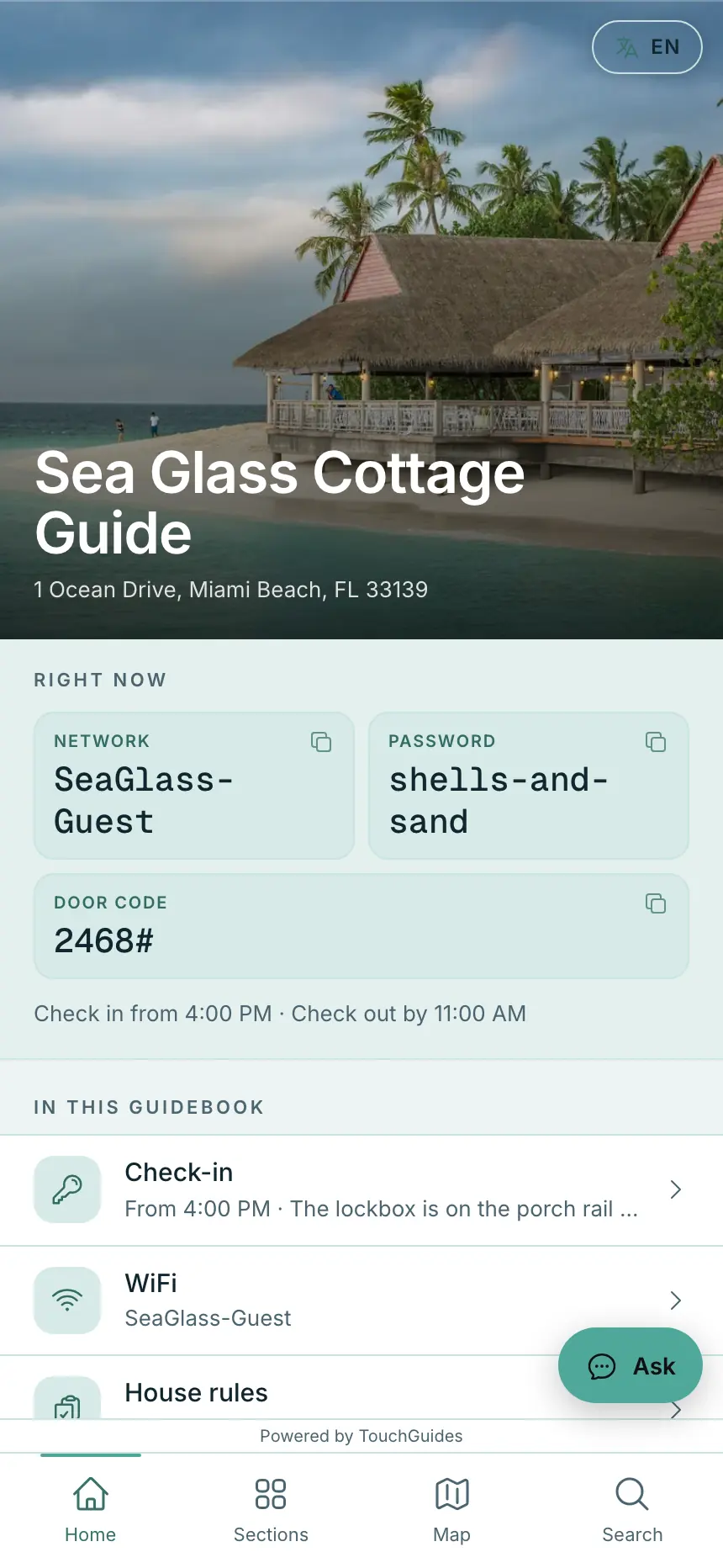 A guidebook open on a phone: the cover photo, the WiFi and door code in an arrival band, then the list of sections